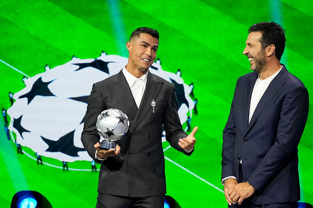 | Photo: AP/Gregorio Borgia : 2024-25 UEFA Champions League Draw: Cristiano Ronaldo speaks after receiving a special award from UEFA President Aleksander Ceferin in recognition of his achievements in the competition